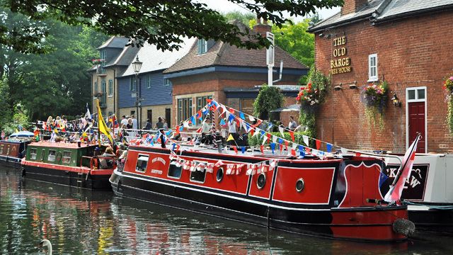 Photo of decorated narrowboats moored up outside The Barge public house in The Folly, Hertford<br />Photograph: Steve Beeston