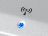 Photo of blue LED in chassis of laptop to indicated an active wireless network connection