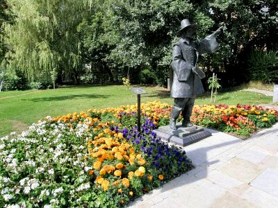 Planting around millenium statue of Sam Stone